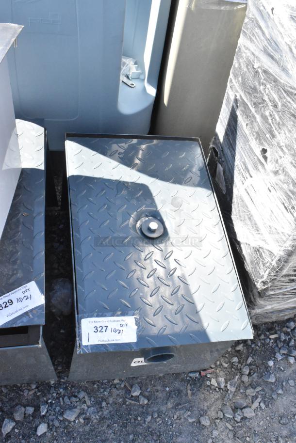 Brand new metal commercial grease trap with diamond plate lid and visible minor scratches. Marked "327" for auction tracking.