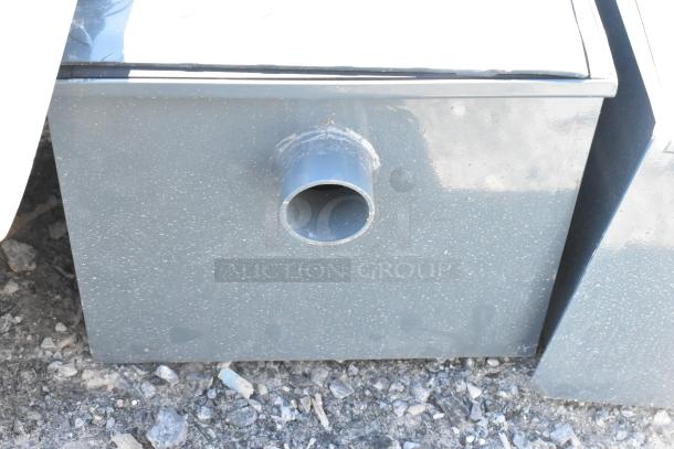 Brand new commercial metal grease trap with visible scratches and dents, indicating minor cosmetic damage.