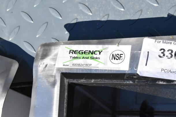 Regency 600IB2418CP stainless steel ice bin with cold plate, new with minor scratches. NSF certified label visible.