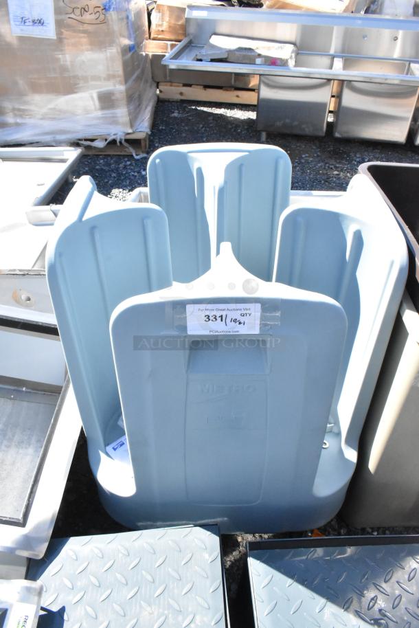Brand new Metro PCD9 blue poly dish cart with commercial casters, slight scratch and dent, auction label visible.