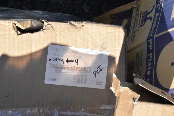 Damaged cardboard box of 784QSB104BK Regency Black Shelf Bins; label indicates case of 20, missing 4 bins.