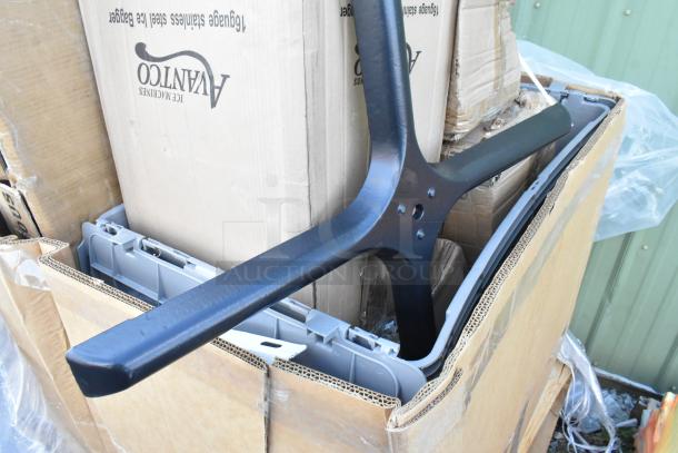 Cardboard box with mixed items, including a black table leg and Avanco ice bagger box, indicating scratch and dent condition.