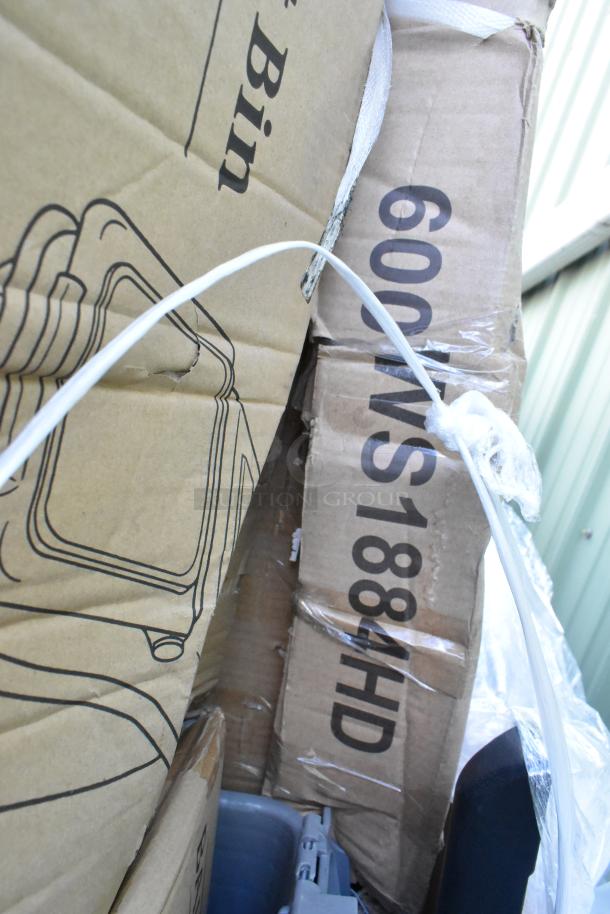Boxes containing 12 brand new items with scratch and dent marks, including an ice bagger and ticket holder.