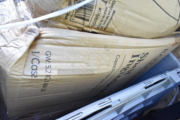Box labeled "GW: 52 lbs" showing partial view of new scratch and dent items including industrial equipment.