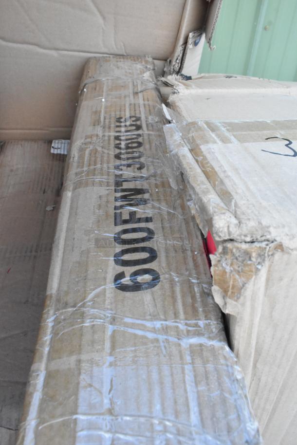 Cardboard boxes showing "600 FW" marking, part of a lot including new scratch and dent items like an ice bagger and sink.