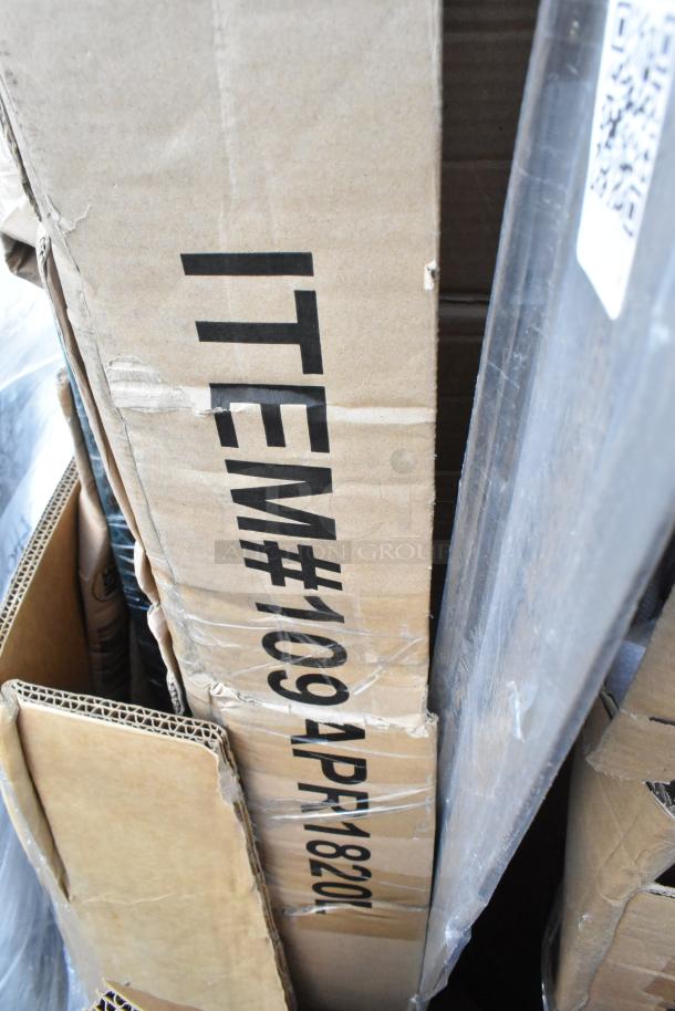 Auction lot of 12 new items, some scratched or dented, includes ice bagger, ticket holder, sink, and table in boxes.