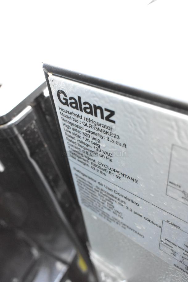 6 mini coolers including Nostalgia IRF32BK and Galanz GLR33MBKE23. Label shows 120VAC, 3.3 cu ft capacity.