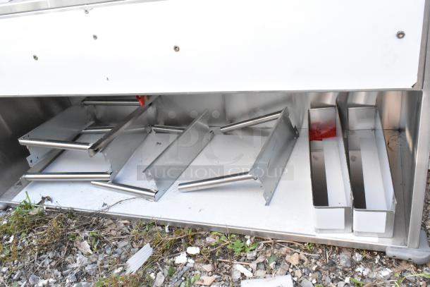 BRAND NEW SCRATCH AND DENT! Regency 600PB63B 63" stainless steel portable bar, two removable speed rails, ice bin.