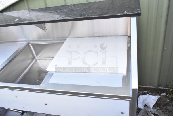 Brand new Regency 600PB63B 63" stainless steel portable bar with two removable speed rails and ice bin. Scratch and dent.