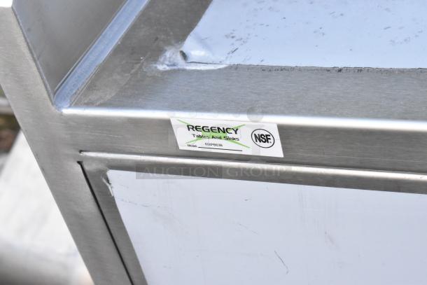 Brand new Regency 600PB63B 63" stainless steel portable bar with speed rails, ice bin; minor scratch and dent. NSF certified.