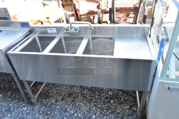 Stainless steel 3 bay back bar sink with right side drain board, faucet, and handles in good condition.