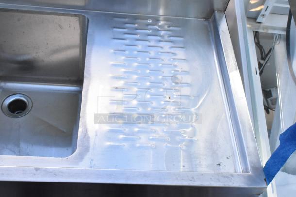 Stainless steel 3 bay back bar sink with right side drain board, faucet, and handles. Good condition, durable design.