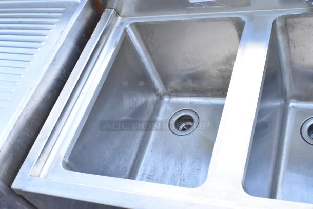 Stainless steel 3-bay back bar sink with right side drain board, faucet, and handles in good condition.