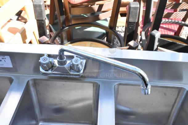 Stainless steel 3 bay back bar sink with right side drain board, faucet, and dual handles, in good condition.