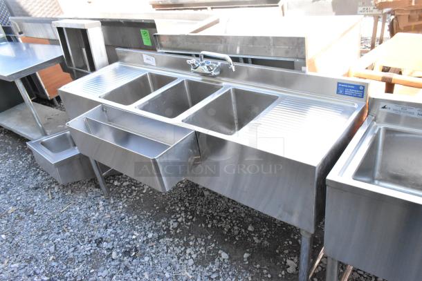 Stainless steel 3-bay back bar sink with dual side drain boards, double speedwell, faucet, and handles. Excellent condition.