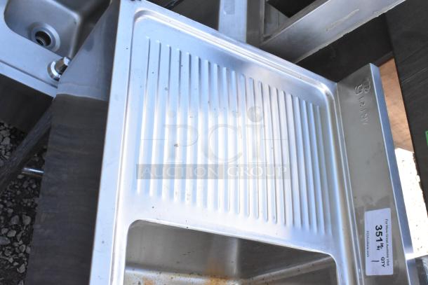 Stainless steel 3 bay back bar sink with dual side drain board, double speedwell, faucet, and handles. Marked "RAJ NY."