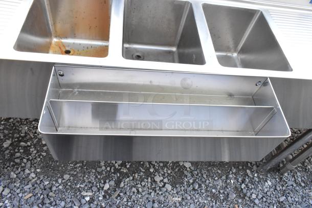 Stainless steel 3 bay back bar sink with dual side drain board, double speedwell, faucet, and handles, in used condition.