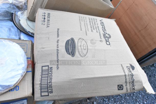 Pallet lot with Versago boxes, indicating 32 oz containers. Includes various supplies and shipping materials. Visible labels.
