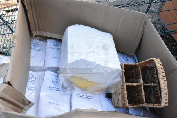 Pallet lot with boxed CTR64BD disposable bowls, napkins labeled "Corporate Caterers," and a wicker basket.