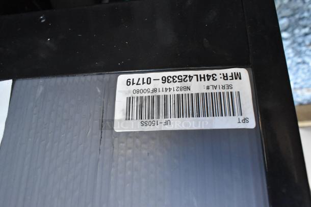 Label on a pallet with serial number NB82144181F50080 and MFR 3H4L4235336-01719. Part of a lot including a mini cooler, bowls, and napkins.