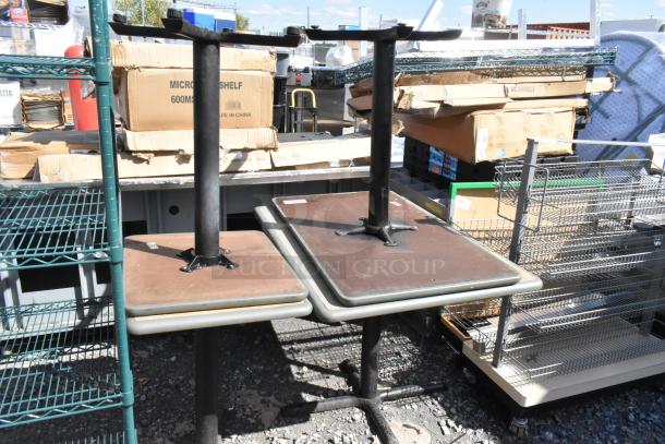 Four dining height tables with metal bases and square wood tops, used condition. Includes four times your bid deal.