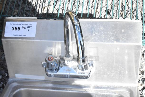 Stainless steel wall mount sink with single bay, chrome faucet, and handles. Includes auction tag reading "366 QTY 1".