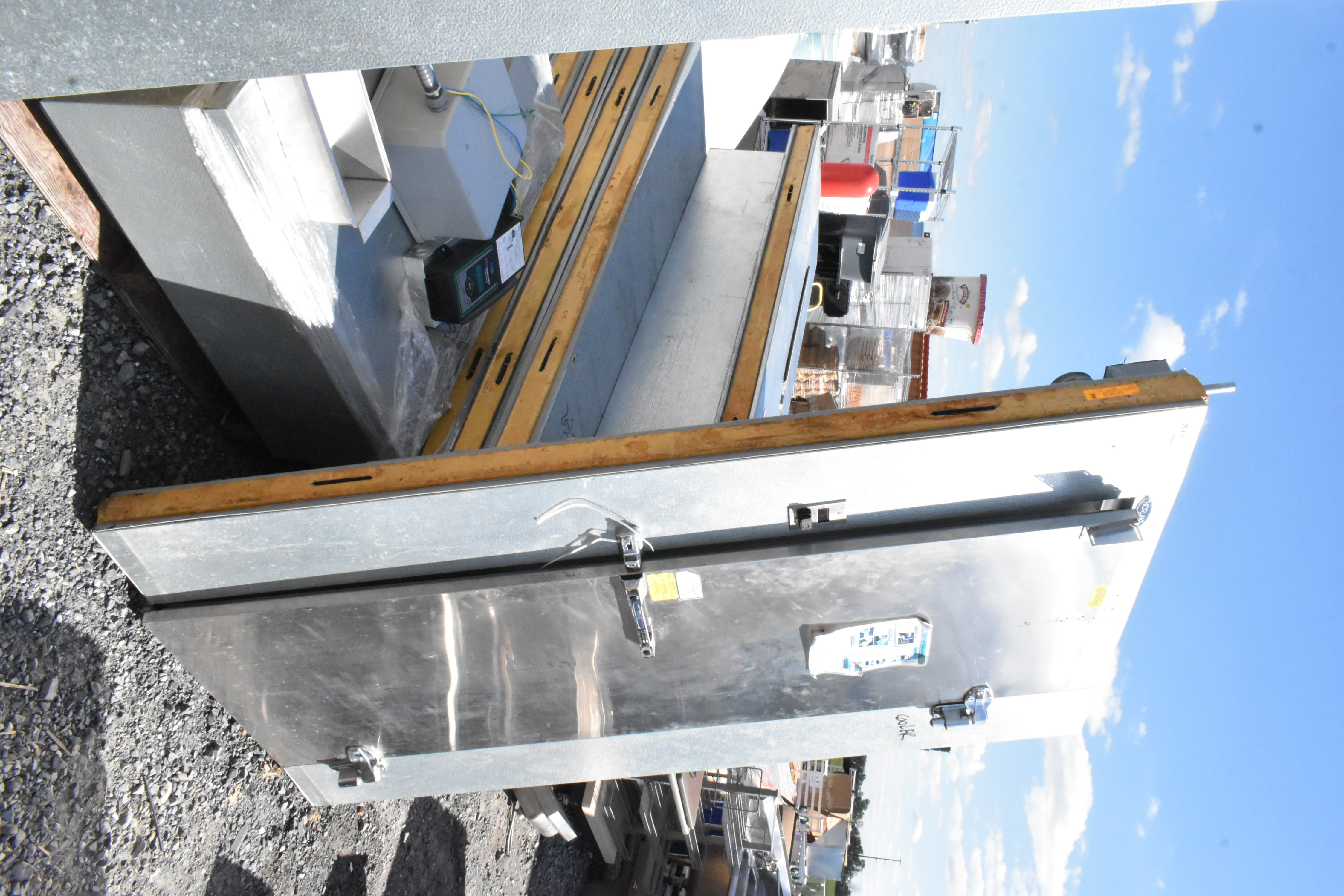 Disassembled walk-in cooler panels ready for assembly