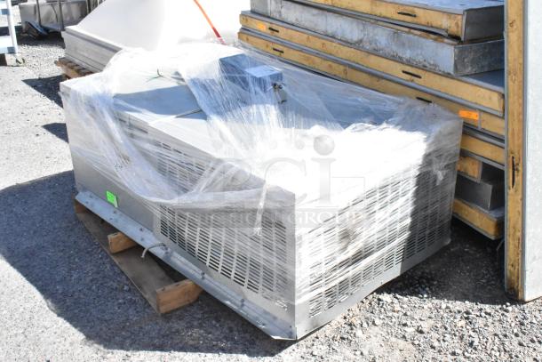 Norlake self-contained walk-in box with Norlake condenser, wrapped in plastic, 208-230 volts, 1 phase.