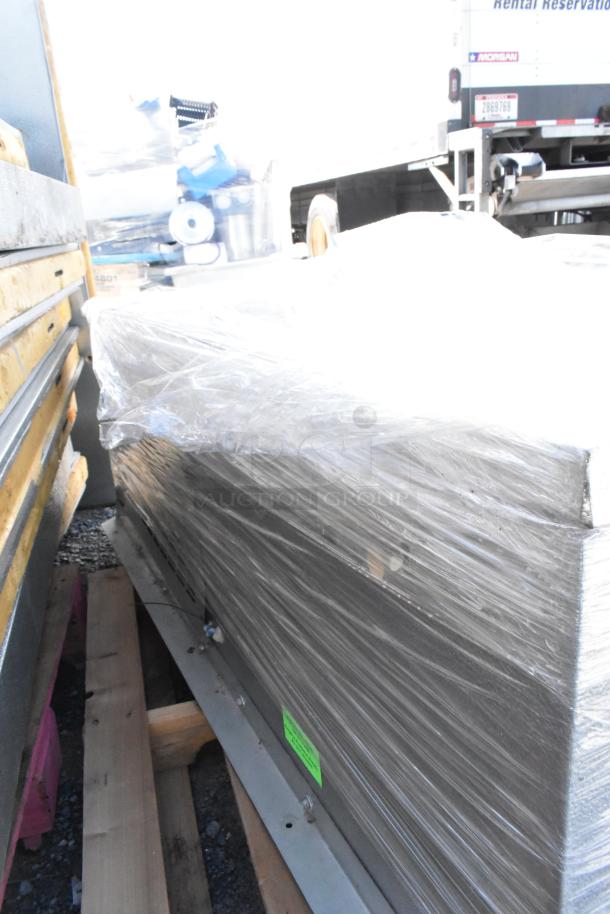Norlake self-contained walk-in box with Norlake condenser, wrapped in plastic; 208-230 volts, 1 phase.