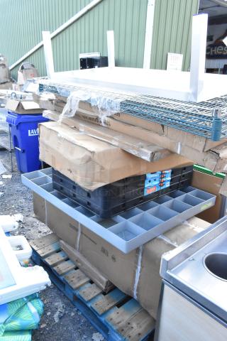 9 new scratch and dent items on a pallet; includes Regency and Avantco stainless steel shelves and overshelves, boxed.