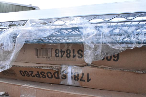 9 new scratch and dent items, including stainless steel pass-through and double deck overshelves, boxed with labels visible.