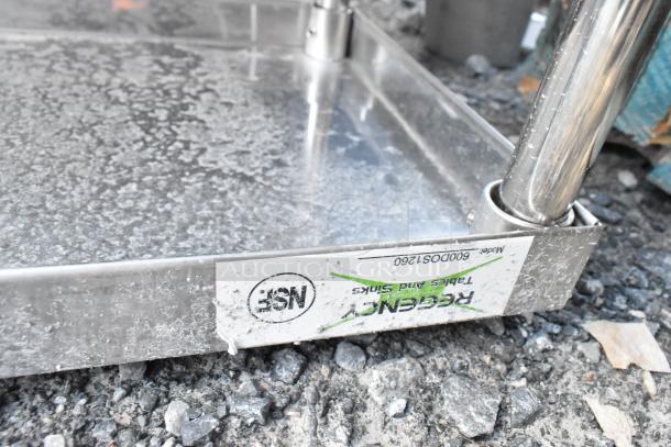 Stainless steel Regency 600DOS1260 2-tier over shelf with visible label showing model number on sturdy metal surface.