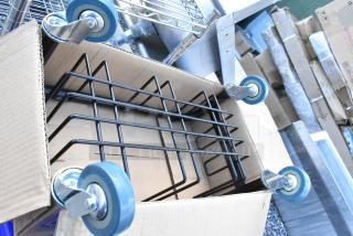 Lavex Black Slim Trash Can Dolly, model 475WRDOLLY, new with slight scratches, featuring durable blue caster wheels.