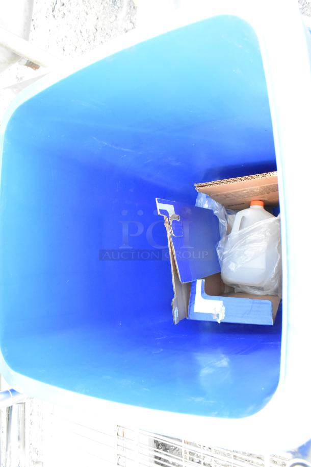 Brand new Lavex blue poly trash can with minor scratches and dents. Durable build, spacious interior, ideal for waste management.