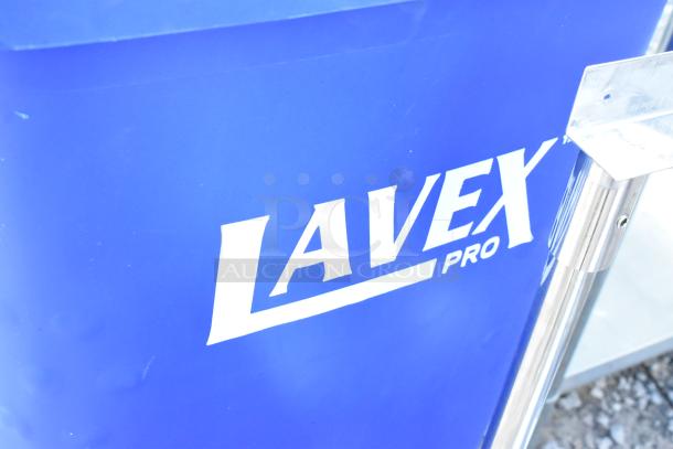 Brand new Lavex blue poly trash can, slightly scratched and dented, with visible Lavex Pro branding.