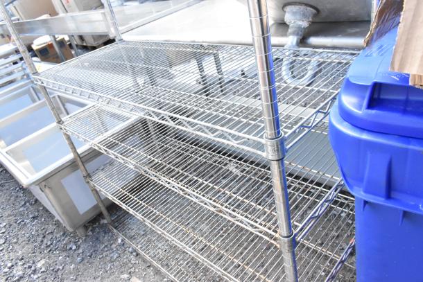Chrome finish 5-tier wire shelving unit in used condition. Buyer must dismantle for shipping. Consider freight charges.