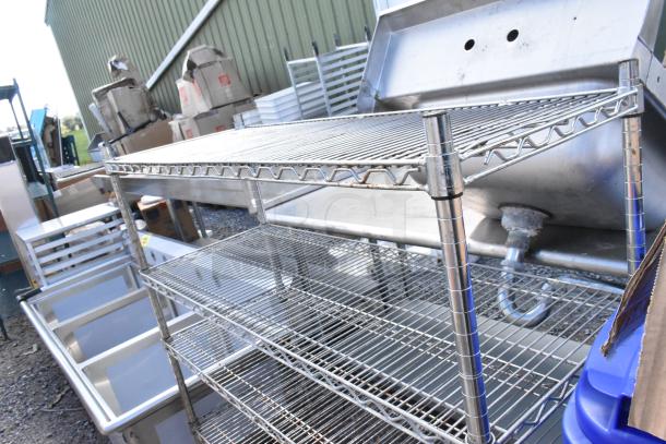 Chrome finish 5 tier wire shelving unit, in good condition. Requires dismantling by buyer. Consider freight costs.