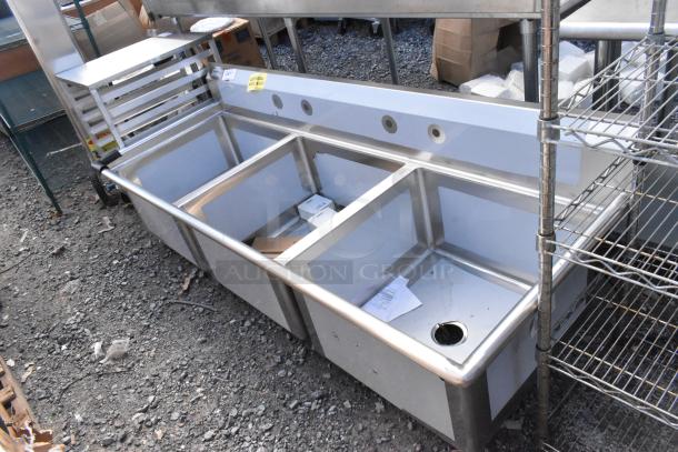 Regency 600S32424 stainless steel 3-bay sink, brand new with minor scratches and dents, featuring durable construction.