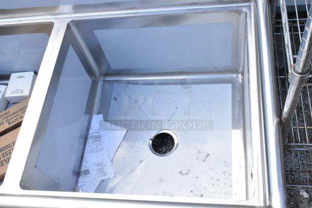 Regency 600S32424 stainless steel 3 bay sink, brand new with visible scratches and dents.
