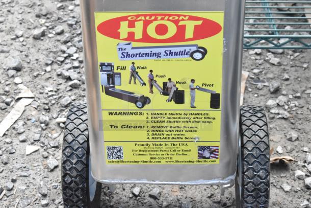 Brand new Shortening Shuttle SS-611-T, 80 lb. tall waste oil transport container, visible warnings and instructions on label.