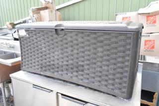 Poly outdoor storage box with a woven pattern, dark gray color, in good condition. Label with item number "380" visible.
