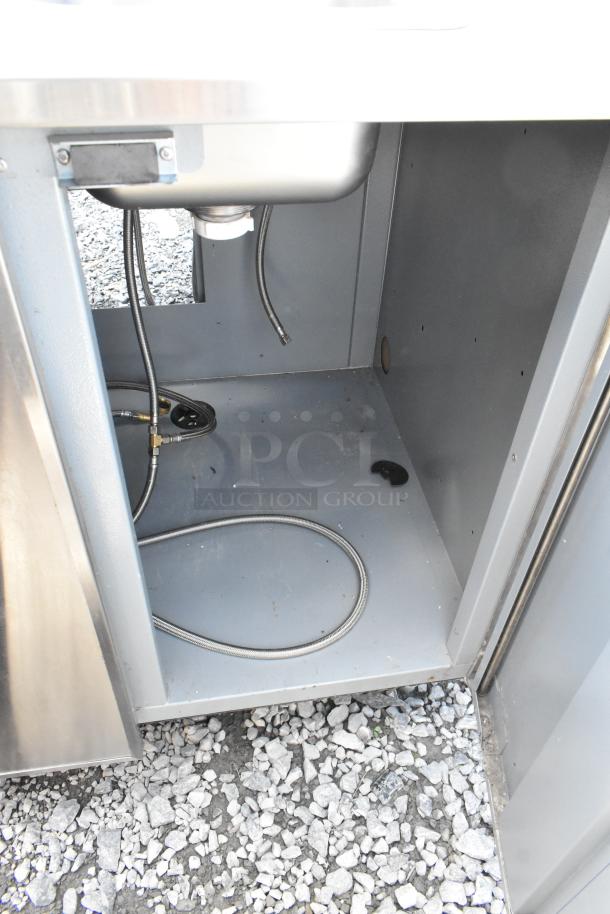 Duke SUB-PS-36-RM stainless steel counter with sink bay, spacious storage, visible plumbing, model details, good condition.
