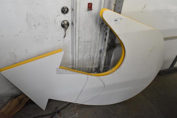 White subway arrow sign with yellow trim, in good condition. Auction label reading "For Sale: Great Auction Item, QTY 2".