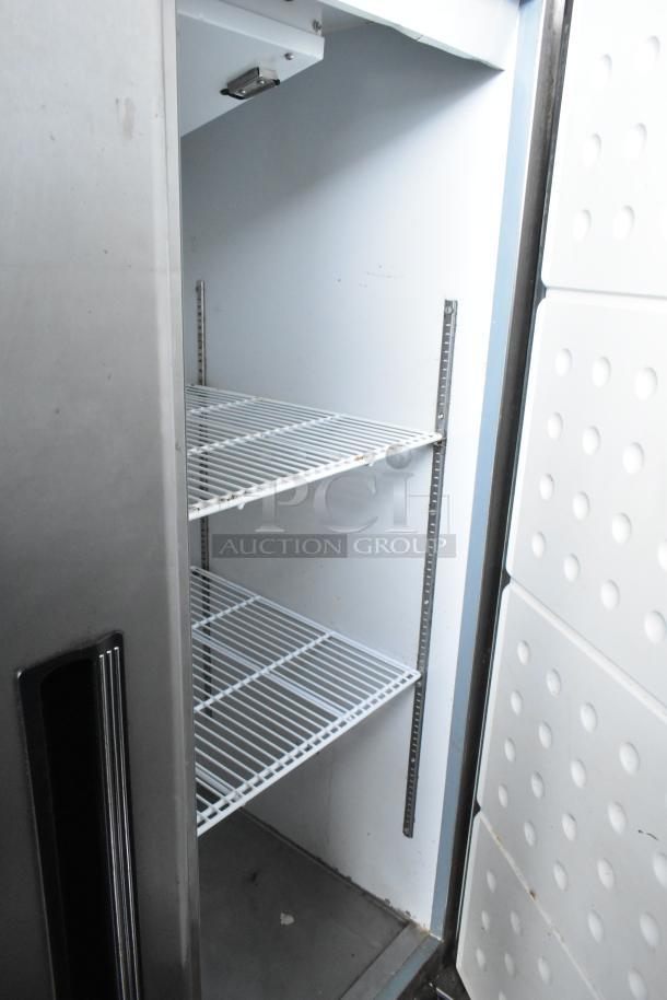 Centaur 69K-035 stainless steel commercial 2-door reach-in freezer with racks, 115 volts, 1 phase; lightly used condition.