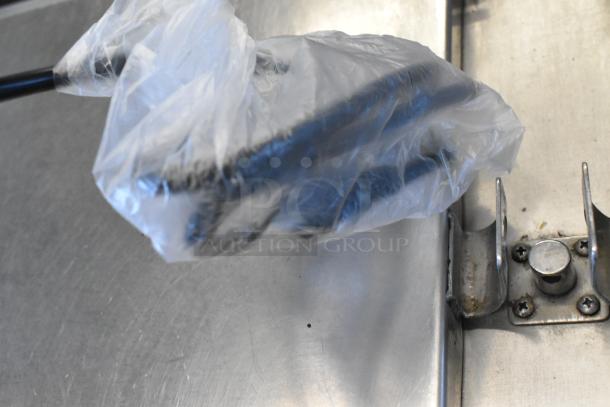 BRAND NEW SCRATCH AND DENT 2025 Avantco 177IC18DB Double Induction Cooker. Image shows part of the cooker in packaging.