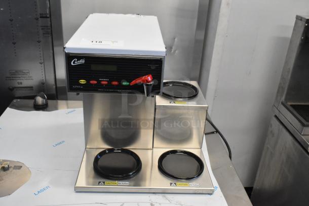 Curtis ALP3GTR12A000 stainless steel coffee brewer, 12-cup capacity, 3 lower warmers on right, 120V, brand new condition.