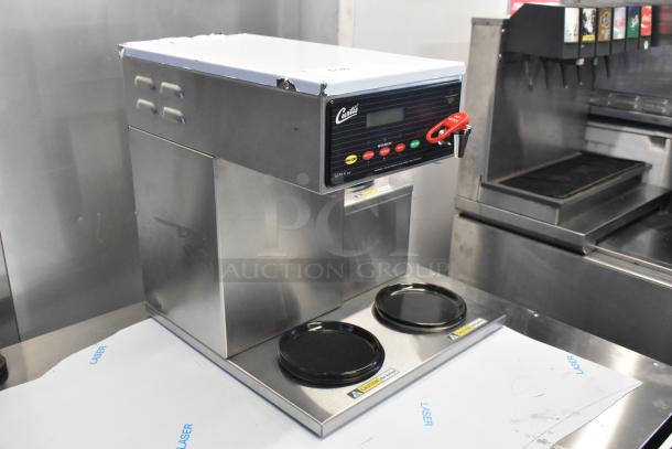 Brand new Curtis ALP3GTR12A000 coffee brewer, stainless steel, 12-cup capacity, 3 right-side warmers, 120V, 1-phase.