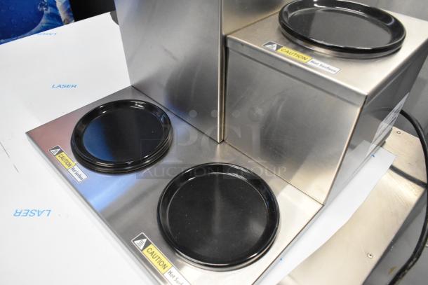 Curtis ALP3GTR12A000 coffee brewer with three lower warmers, stainless steel, brand new with caution labels visible.