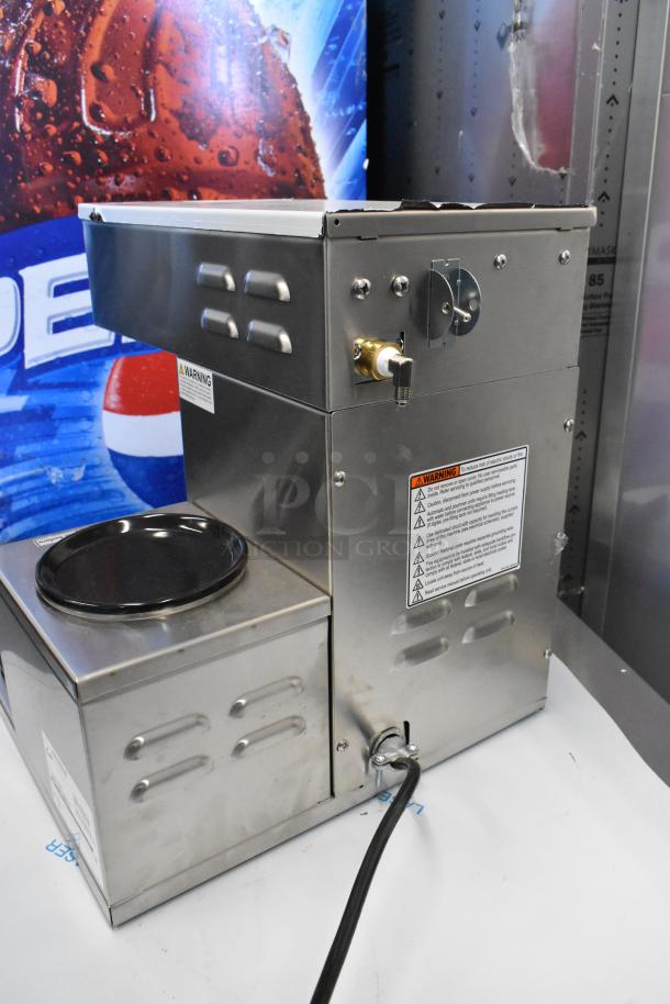 Brand new Curtis ALP3GTR12A000 stainless steel 12 cup coffee brewer, 3 lower warmers on right, 120V, scratch and dent condition.