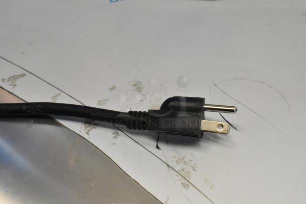 Black power cord with a three-prong plug, part of the Curtis ALP3GTR12A000 coffee brewer.